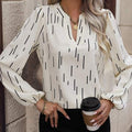 Camicia donna a maniche lunghe con scollo a V, aderente e stampata, marca Valstrend, con motivo decorativo.