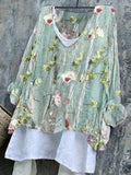 Camicia femminile con scollo a V a maniche lunghe con motivo floreale, marca Valstrend shop, vista frontale.