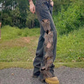Jeans donna Valstrend con vita alta, ricami, buchi, farfalle e gamba larga in stile retrò e moda casual.