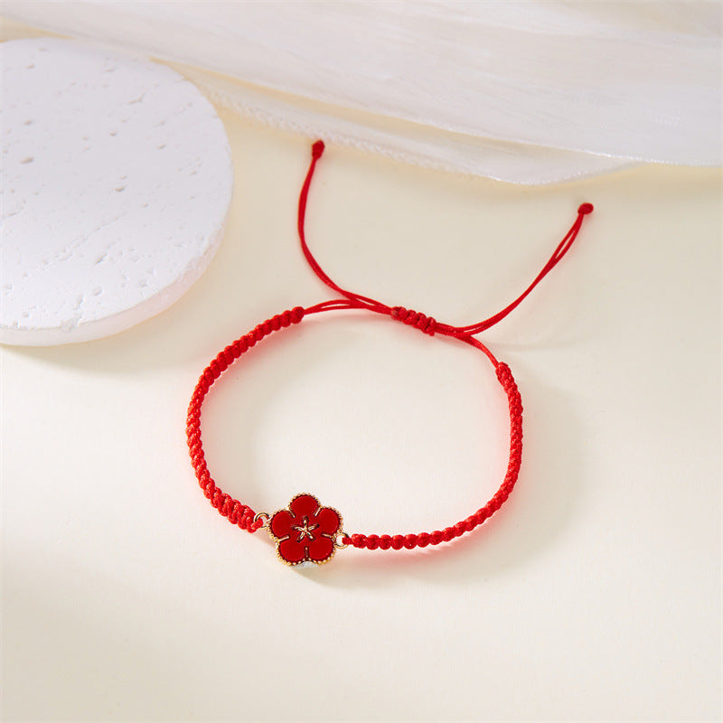 Bracciale donna con fiori fatto a mano, gioiello di moda Valstrend, dettagli colorati e intrecci eleganti.