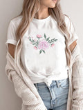 T-shirt donna con maniche corte e stampa floreale colorata, marca Valstrend, tessuto morbido e leggero, ideale per l’estate.