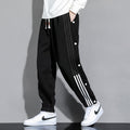 Pantaloni sportivi da uomo Valstrend in stile autunnale, con vita elastica e lacci alle caviglie, taglio largo e comodo.