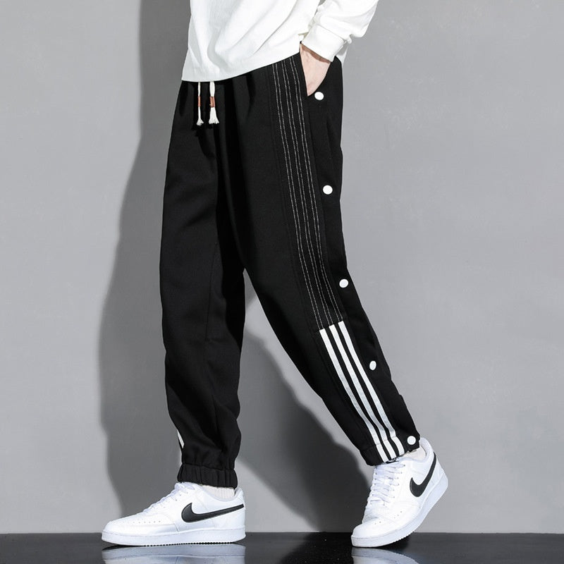 Pantaloni sportivi da uomo Valstrend in stile autunnale, con vita elastica e lacci alle caviglie, taglio largo e comodo.