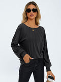 Top donna Valstrend a maniche lunghe con collo rotondo e plissettature, in tessuto leggero e elegante.