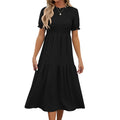 Vestito estivo Valstrend con scollo rotondo, maniche a sbuffo e pieghe, taglio corto, stile elegante e femminile.