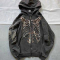 Maglione con cerniera distressed in stile ossa, da uomo e donna, marchio Valstrend Shop, dettaglio tessuto e design casual.