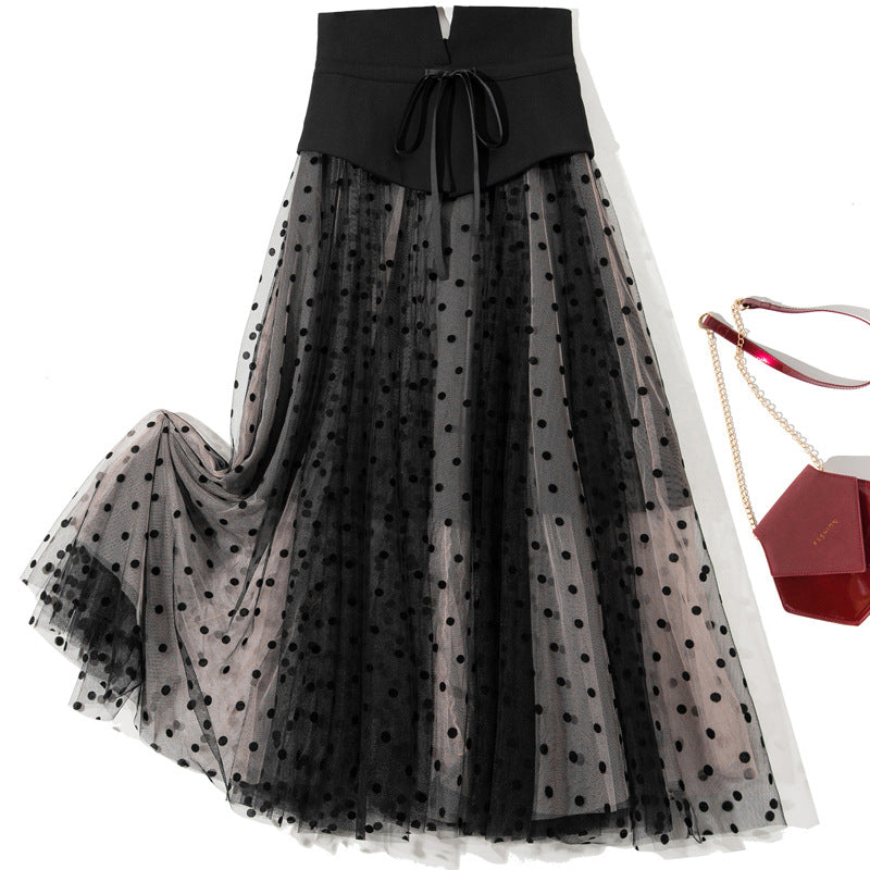 Gonna a fascia alta con motivo a pois in contrasto e fiocco, gonna Valstrend Shop in stile trendy e femminile.