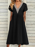 Vestito da donna Valstrend elegante con scollo a V e dettagli in pizzo, ideale per occasioni speciali.