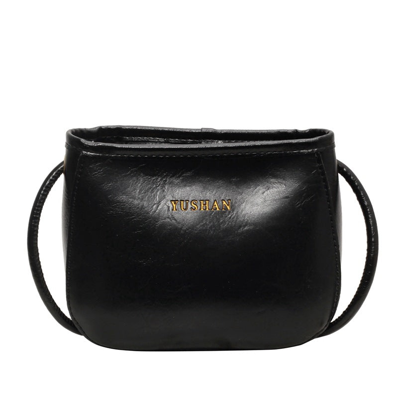 Borsa a tracolla donna in stile retrò Valstrend con design a secchiello, materiali di qualità e dettagli eleganti.