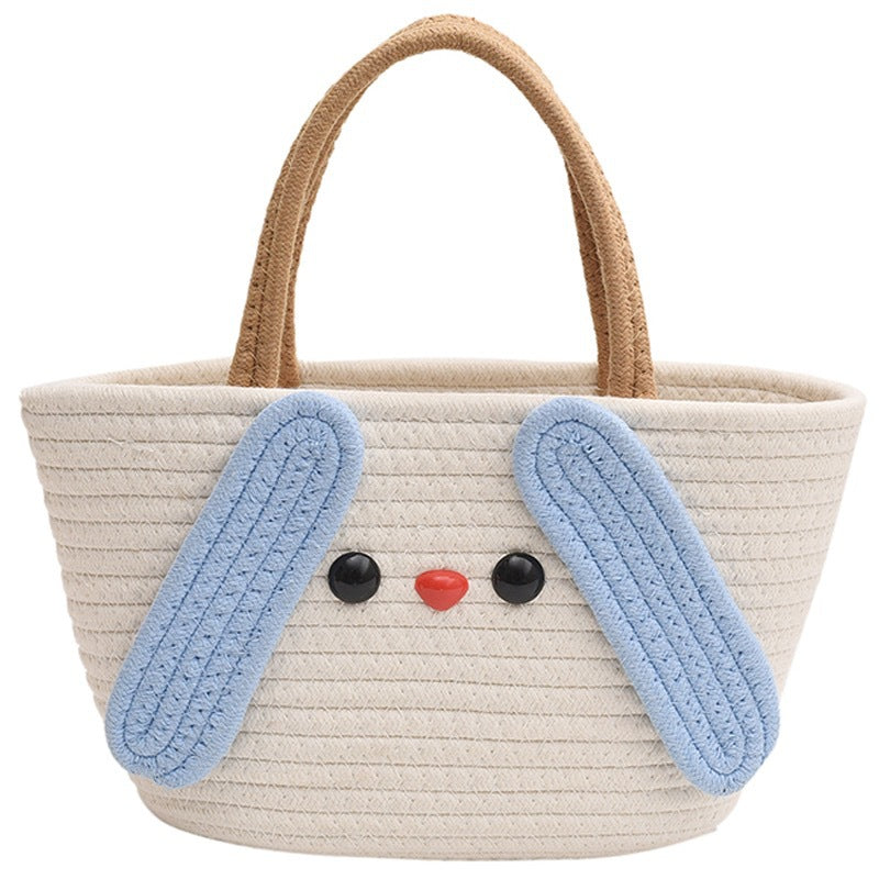Borsa cartone con manico, stile artigianale, in tessuto a maglia, marchio Valstrend, dettagli colorati e design originale.