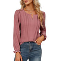 Blusa donna a maniche lunghe con scollo a V e righe, marca Valstrend, visibile con dettagli a righe nere e bianche.