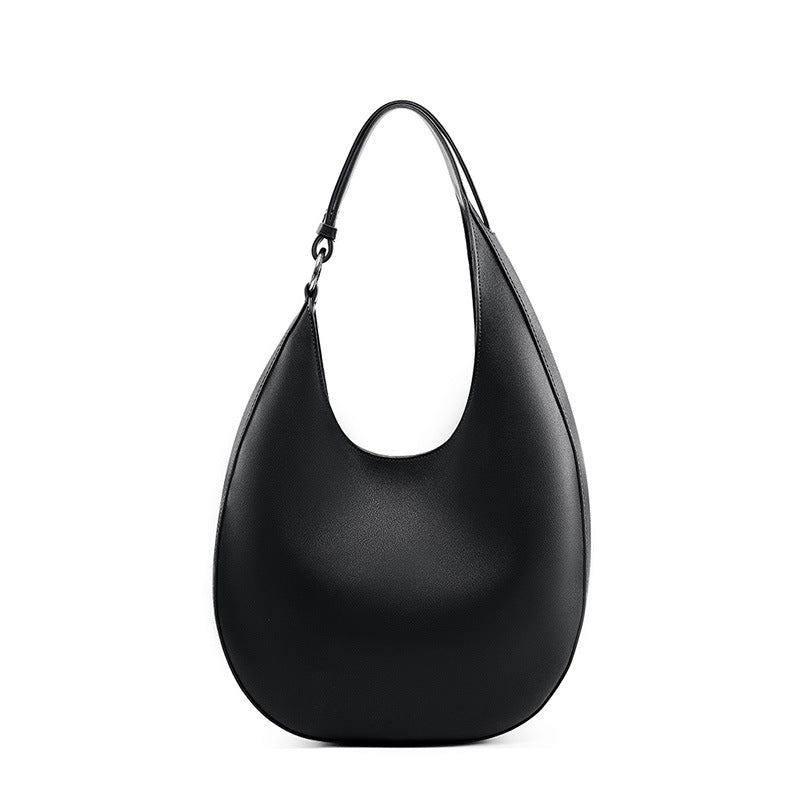 Borsa semicircolare con profilo a selenodonte di design speciale, marca Valstrend, vista dall'alto, dettagli eleganti e moderni