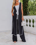 Completo donna senza maniche nero con cintura in vita e dettagli a contrasto, marca Valstrend Shop, vestito elegante e moderno