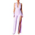 Comoda tuta estiva senza schiena Valstrend, con scollo a V, dettagli slit e forma slim, ideale per look estivi eleganti.