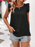 Top donna Valstrend con schiena elastica a incrocio e stile alla moda, visibile in primo piano sulla modella.