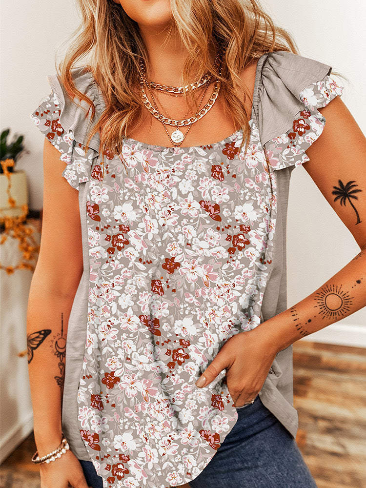 Top senza maniche Valstrend con colletto quadrato e motivo floreale, design a balze, stile fashion e femminile.
