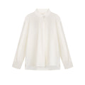 Camicia minimalista da donna Valstrend con taglio irregolare e spacchi, tessuto morbido e stile elegante.