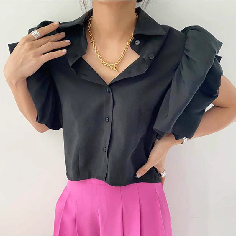 Camicia blu Palace per donna di stile lapel e peplum, marca Valstrend, vista in primo piano su sfondo neutro.
