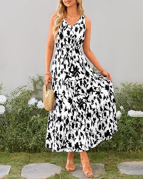 Vestito donna Valstrend con scollo a V, vita elastica e stampa floreale, lungo fino al ginocchio, tessuto leggero e comodo.