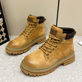 Stivaletti biker retro Dr Martens donna con tacco nascosto e piattaforma, stile unico e robusto, in pelle nera.