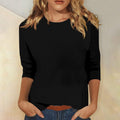 Top donna Valstrend con collo rotondo e maniche a 3/4, tessuto morbido e stile elegante, visibile in primo piano.