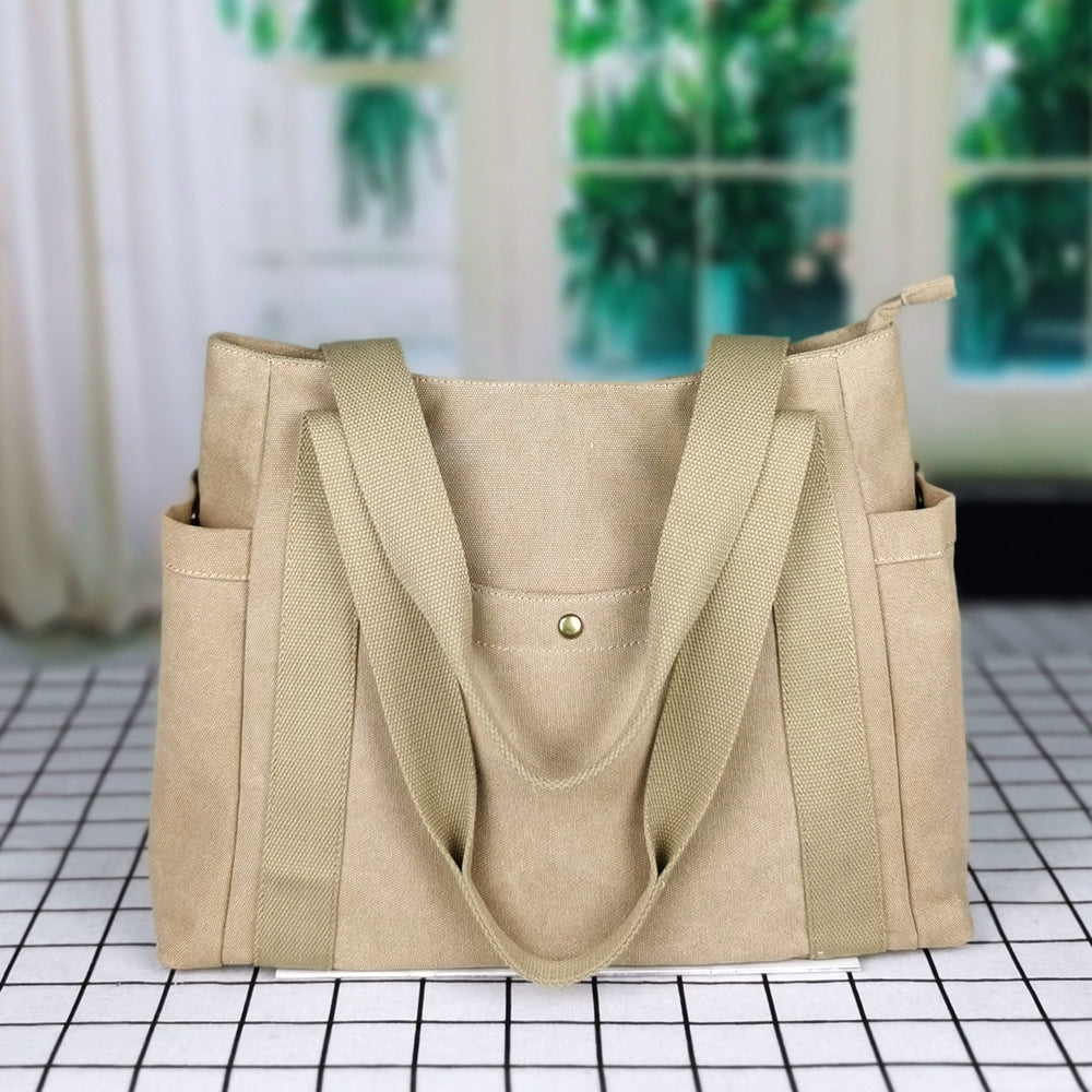 Grande borsa in tela con ampia capacità, valigia Valstrend, ideale per uso quotidiano e trasporto di oggetti.