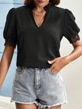 Top da donna Valstrend, maglia a V con maniche a lanterna e dettagli in pizzo, stile fashion e femminile.