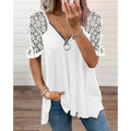 Maglietta donna Valstrend con cuore a fantasia, dettagli in pizzo e zip frontale, stile femminile e alla moda.