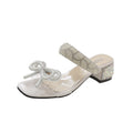 Sandali donna Valstrend con fiocco, tacco chunky, strap trasparente e design estivo elegante.