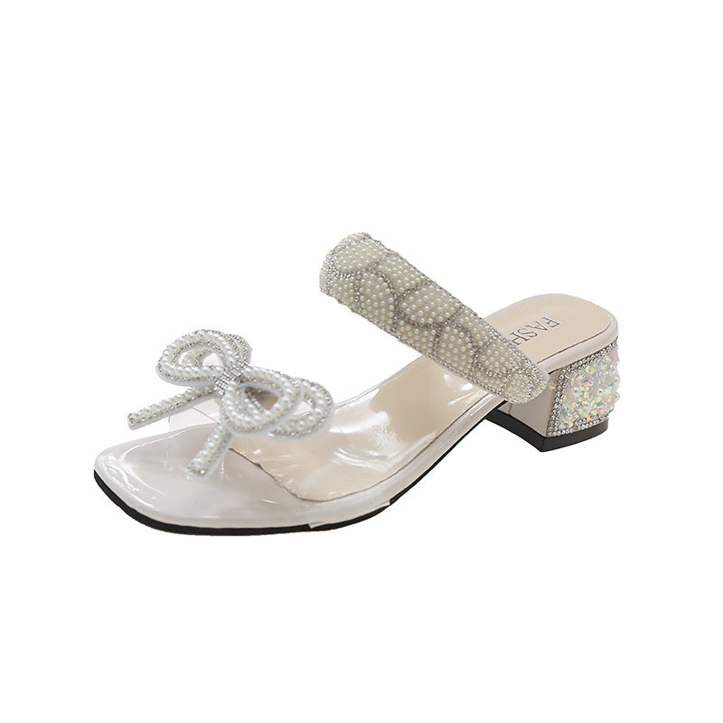 Sandali donna Valstrend con fiocco, tacco chunky, strap trasparente e design estivo elegante.