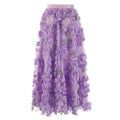 Gonna in mussola con ricamo floreale tridimensionale e paillettes, stile elegante e femminile.