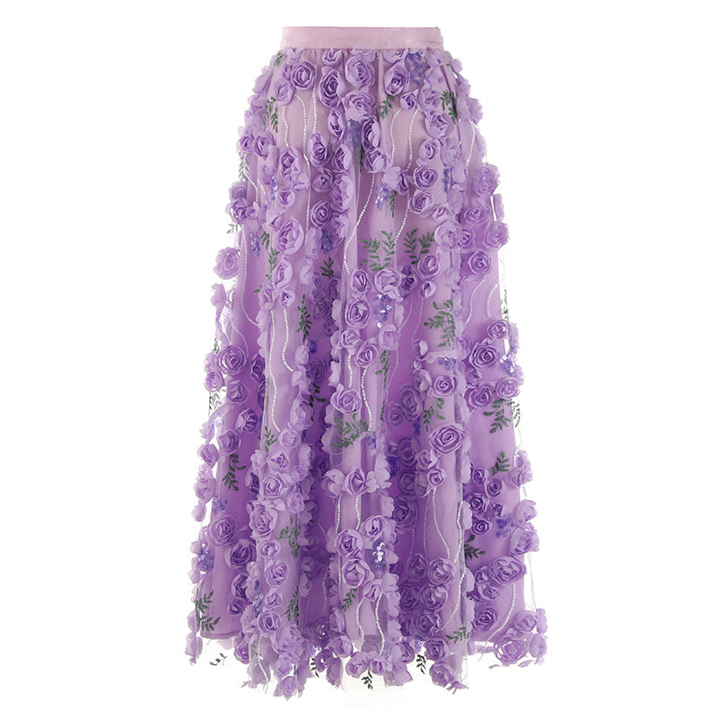 Gonna in mussola con ricamo floreale tridimensionale e paillettes, stile elegante e femminile.