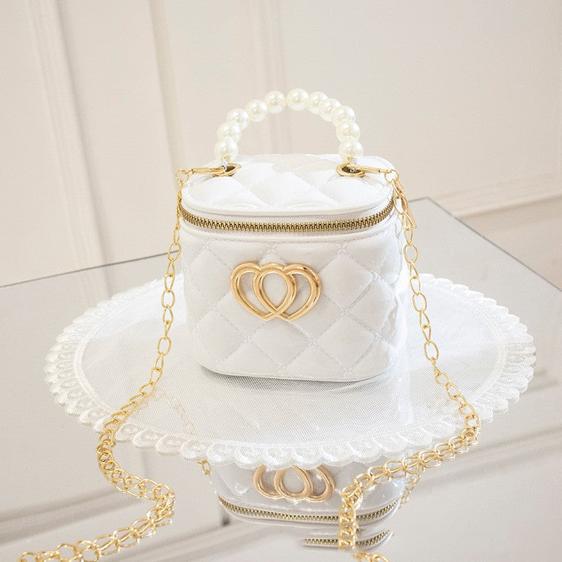 Borsa a secchiello in PVC femminile Valstrend, con design trasparente e dettagli colorati, vista frontale.