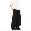 Salopette in stile americano retrò con lacci alle caviglie, pantaloni hip hop color kaki, marca Valstrend shop, vista frontale