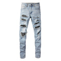 Jeans slim elastic da uomo Valstrend shop con patch in pelle e fori, vestibilità aderente e stile casual.