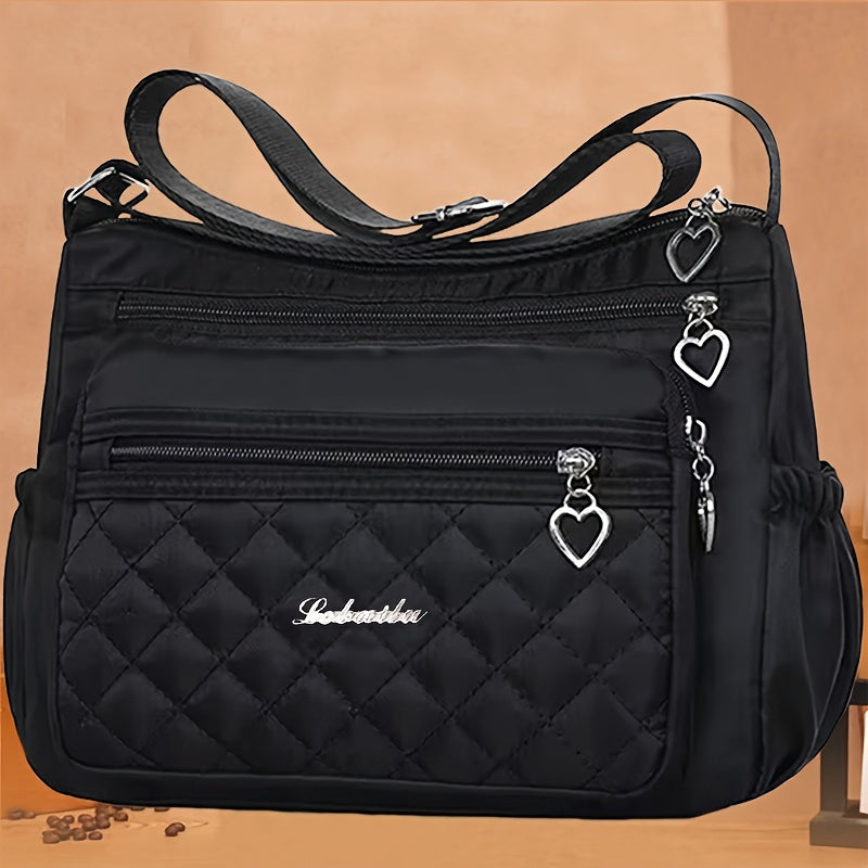 Borsa a tracolla nera in nylon Valstrend, impermeabile, regolabile, leggera, con design trapuntato e chiusura a zip.