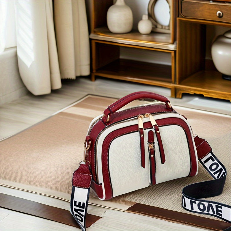 Borsa a tracolla femminile Valstrend in ecopelle casual con traccia regolabile, chiusura con zip e stampa casual.