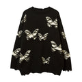 Maglione girocollo a maglia con nappine, motivo a farfalla strappata e ricamo all'uncinetto, marca Valstrend.