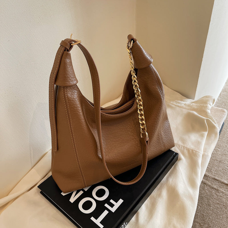 Borsa tote retrò Valstrend con design minoritario, tracolla e manico sottoascella, stile vintage e capiente.