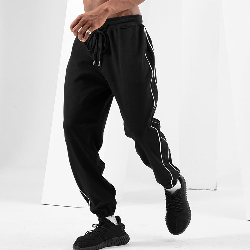 Pantaloni sportivi uomo autunno Valstrend, slim fit e tapered, tessuto leggero per allenamento e attività sportive.