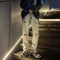 Jeans strappati da uomo Valstrend, stile americano retrò, lavaggio vintage, dettagli distressed, vestibilità moderna.