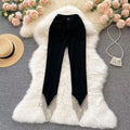 Pantaloni skinny da donna in design Sense con catena diamantata, in tessuto nero, look elegante e alla moda.
