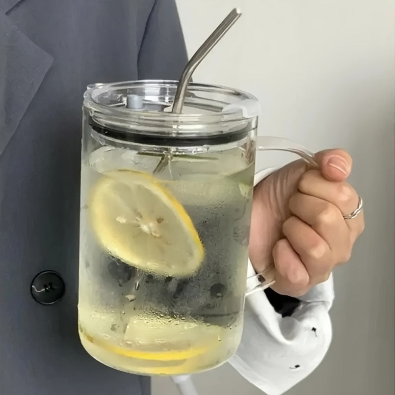 Tazza riutilizzabile e biodegradabile in vetro con coperchio e cannuccia, ideale per bevande fredde e calde in occasioni festive.