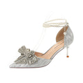 Scarpe con tacco a spillo Valstrend, con fiocco in strass, punta affilata e dettagli a perla, eleganti e sofisticate.
