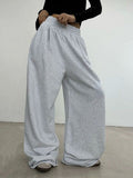Pantaloni sportivi donna Valstrend, dal taglio retro loose e slim, ideali per allenamento e look casual.