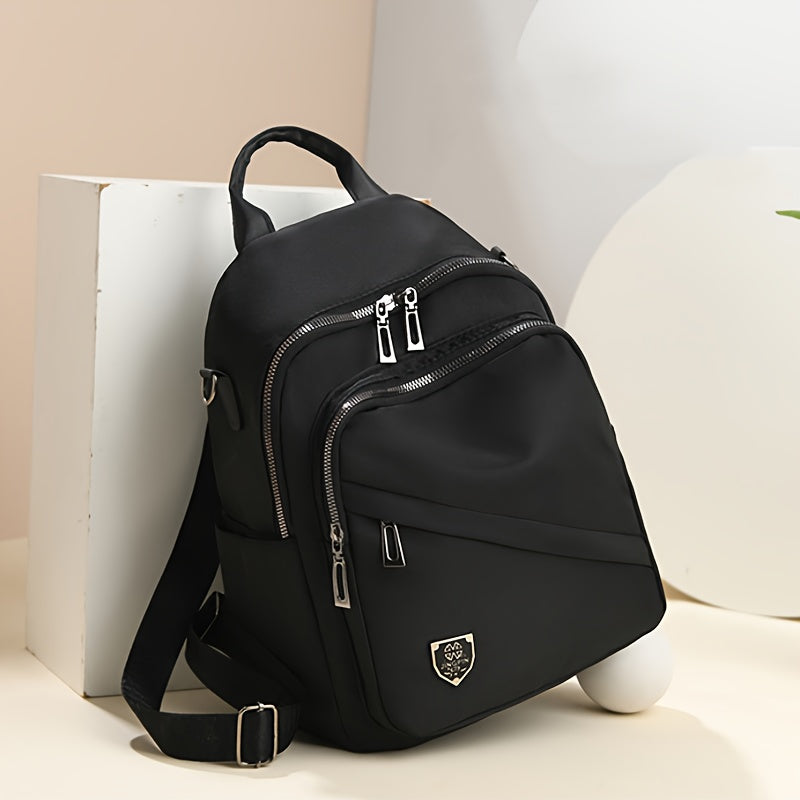 Zaino femminile Valstrend in nylon con grandi scomparti, tracolla regolabile e design classico, ideale per uso versatile.