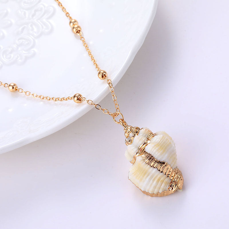 Collana con conchiglia e bordo dorato per donna Ins Style, pendente elegante con dettagli a conchiglia, gioiello estivo di Valstrend shop