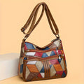 Borsa donna elegante con stampa geometrica in pelle sintetica, tracolla regolabile, ideale per uso quotidiano e viaggi di lavoro.