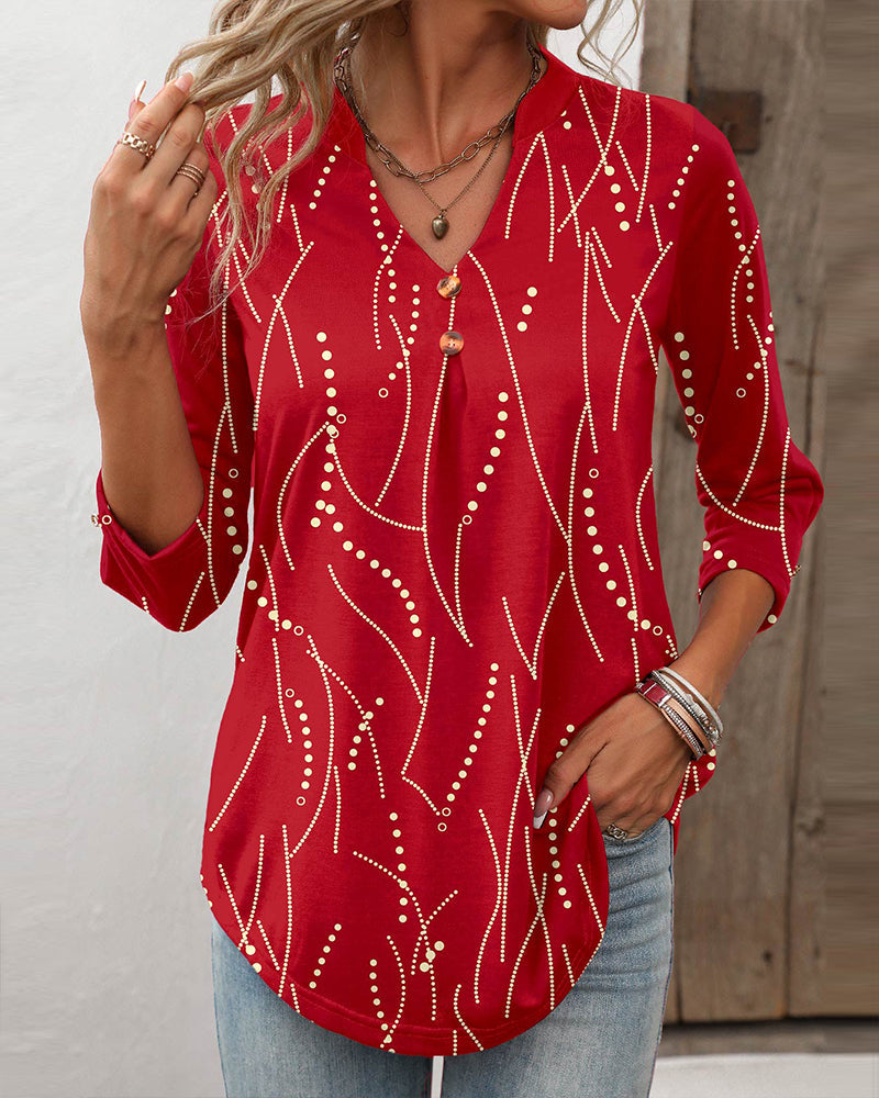 T-shirt donna casual a maniche lunghe con stampa geometrica e bottoni, marchio Valstrend, tessuto morbido e comodo.