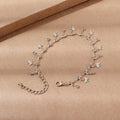 Bracciale alla caviglia con nappe farfalla colorate, fiori e foglie, gioiello Valstrend shop in stile boho e naturale.